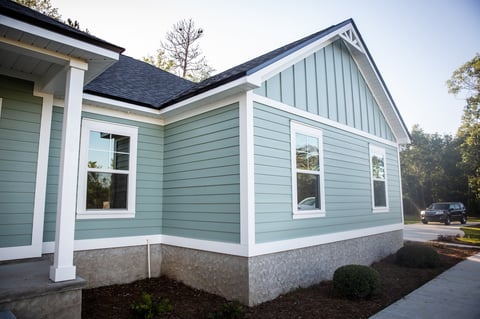 Blue vinyl siding ranch home