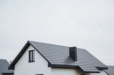 Black asphalt roof with chimney